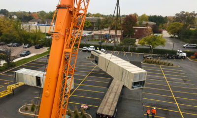 THE NEW UNIT COMES OFF THE TRUCK