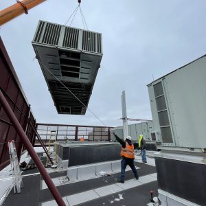 Guiding Unit Number 1 into place. Guiding Unit Number 1 into place.