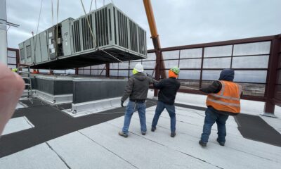 Guiding the old unit up and out!