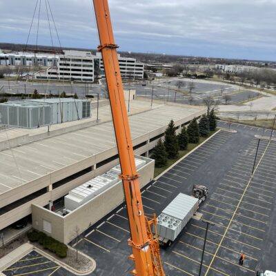 New Unit 2 waits as the old unit hangs in the air. New Unit 2 waits as the old unit hangs in the air.