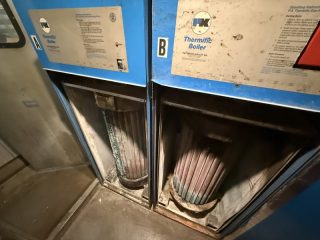 PK Thermific Boilers Internal View - Lake Point Tower Exposed internal tubes of old PK Thermific commercial boilers at Lake Point Tower before a major HVAC system replacement.