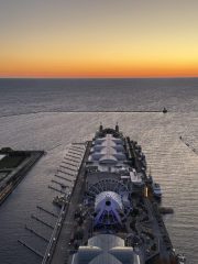 Chicago Navy Pier at Sunrise Chicago Navy Pier aerial view at sunrise featuring the Centennial Wheel and coastal event spaces.
