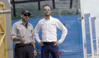 Chicago Commercial HVAC - Building Engineer Project Success Happy building engineers and Temperature Service Company project managers standing proudly in front of a safely delivered commercial boiler at Lake Point Tower in Chicago.