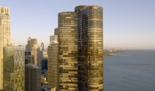Chicago Commercial Real Estate - Lake Point Tower Skyline View Expansive aerial view of Lake Point Tower and the Chicago skyline along Lake Michigan, showcasing the city's premier commercial and residential high-rise architecture.