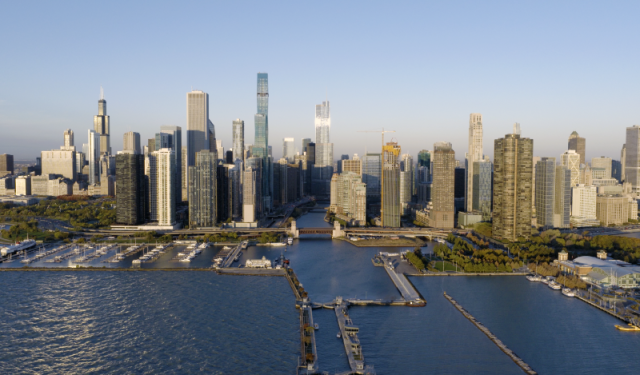 Expansive aerial view of the downtown Chicago skyline and river lock from Lake Michigan, showcasing the city's premier commercial high-rise infrastructure.