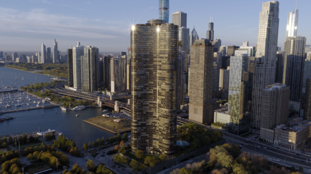 Expansive daytime aerial view of Lake Point Tower prominently featured against the downtown Chicago skyline, showcasing dense commercial high-rise infrastructure along the lakefront.
