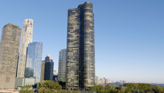 Chicago Commercial Real Estate - Lake Point Tower & Park Aerial Expansive daytime aerial view of Lake Point Tower and neighboring commercial high-rises, featuring lush lakefront park space and Chicago's premier real estate infrastructure.