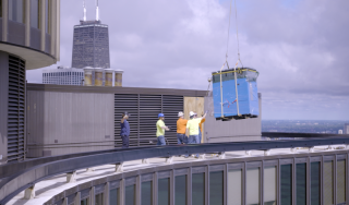 Chicago Commercial HVAC - Rooftop Boiler Helicopter Delivery A heavy-duty helicopter successfully delivers the first high-efficiency commercial boiler to the rooftop of Lake Point Tower, marking a major milestone in a massive Chicago HVAC upgrade.
